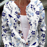 Birgit - Wit-blauw gebreid vest met bloemen & vogels