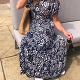 Marit | Lange jurk met korte mouwen en bloemenprint