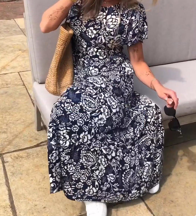 Marit | Lange jurk met korte mouwen en bloemenprint