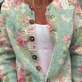 Christa - Saliegroen vest met rozenpatroon