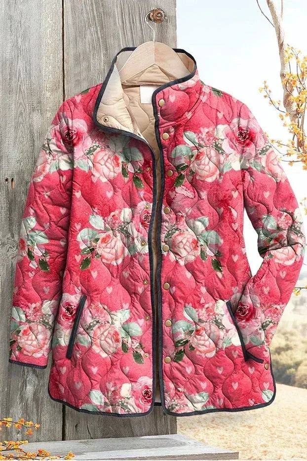 Roosmarijn - Roze gewatteerde jas met bloemenpatroon - productfoto
