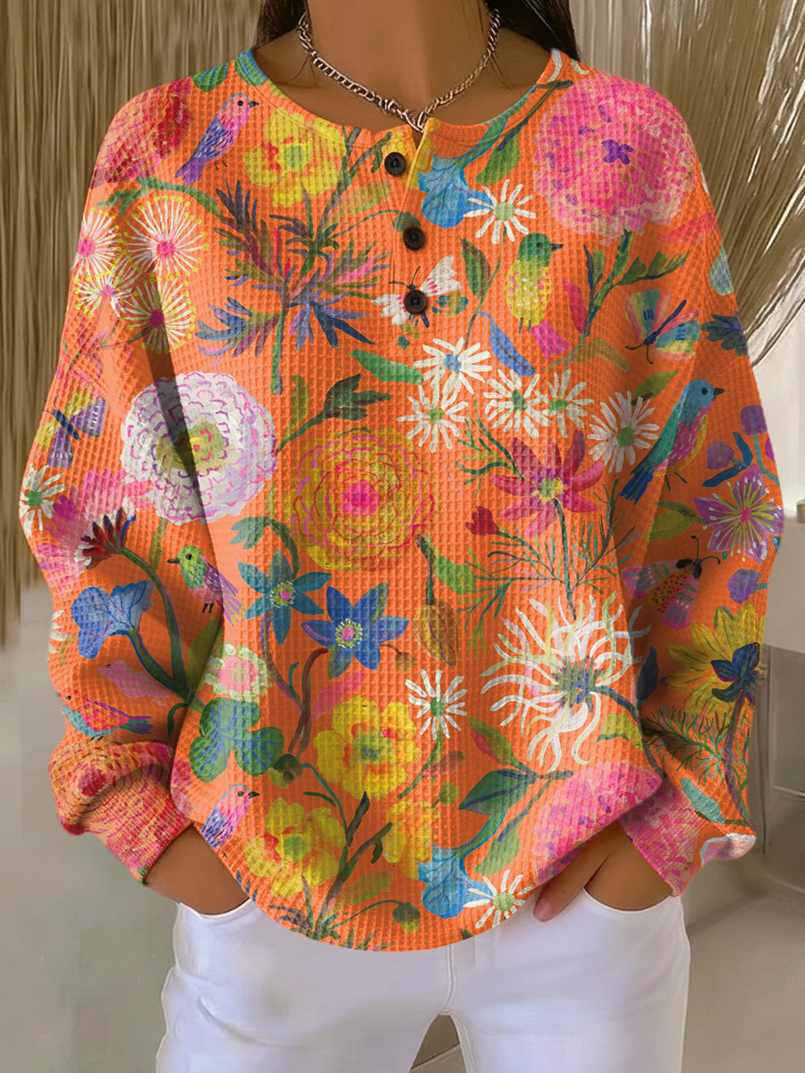 Britt - Trui in oranje met bloemen - Oranje