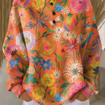 Britt - Trui in oranje met bloemen - Oranje