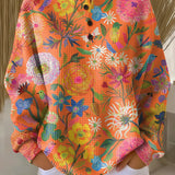 Britt - Trui in oranje met bloemen - Oranje
