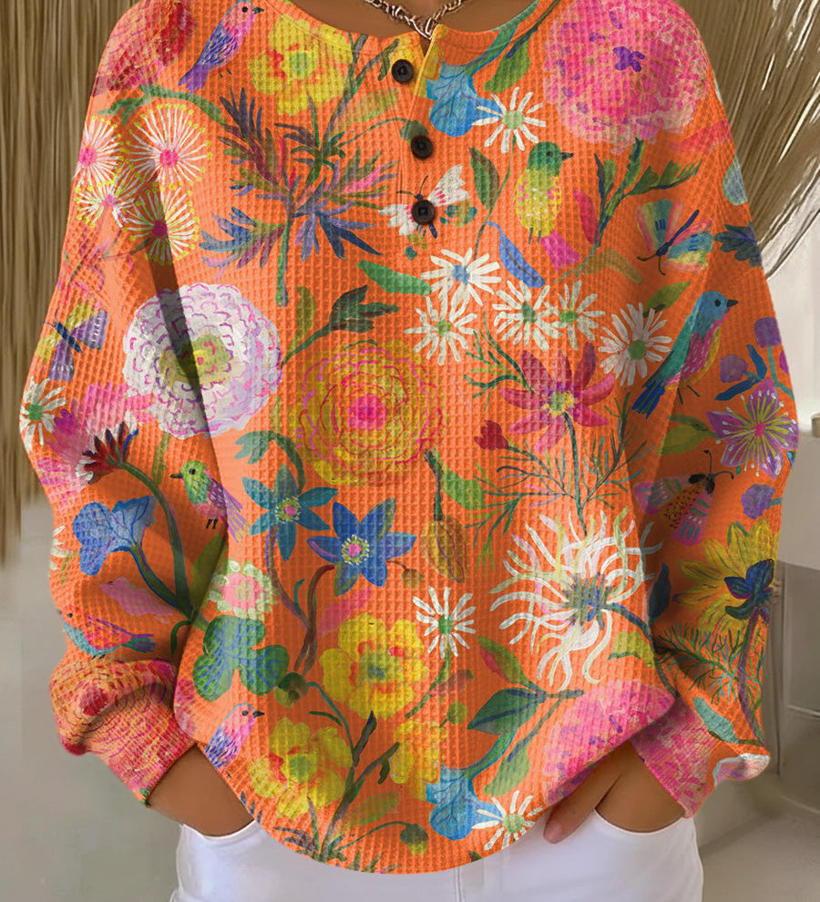 Britt - Trui in oranje met bloemen - Oranje
