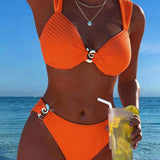 Bikini met verticale strepen en metalen gesp